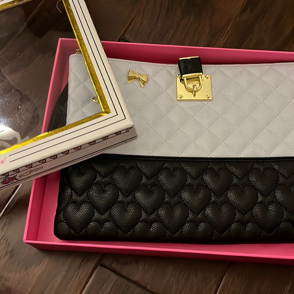 Brand new. VERY LARGE CLUTCH. NWT Betsy Johnson wristlet. Great for traveling!!